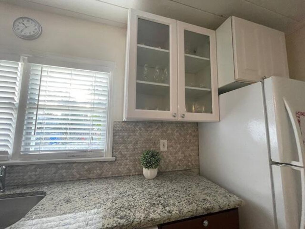 Photo of 1008 2nd Street, Lake Park, FL 33403 (MLS # R11103614)