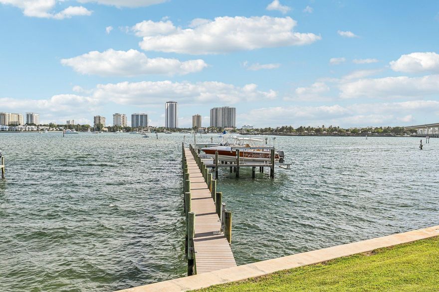 *NEED A DOCK** - This lovely second-floor waterfront property offers stunning intercoastal water views, along with dramatic sunsets and sunrises visible from your bedroom or kitchen patio area. Additionally, it is located on a quiet street and features a common pier that can accommodate boats up to 40 feet. Note that approval may be required to install a boat slip, which comes at a nominal cost.