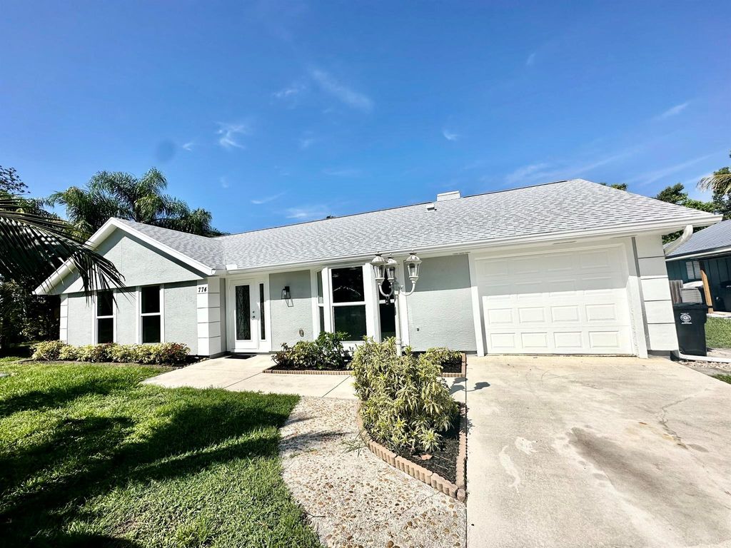 Photo of 774 SE Whitmore Drive, Port St Lucie, FL 34983 (MLS # R10900069)