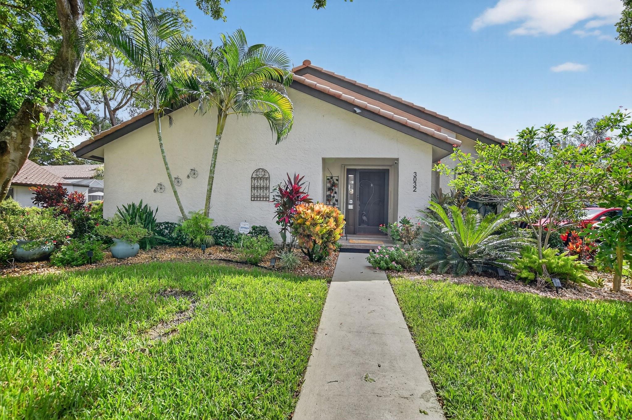 This beautifully updated 2-bedroom, 2-bathroom villa is ready for you to call home. Natural light pours in through new impact windows and sliders, providing peace of mind and energy efficiency. The kitchen is a chef's delight with newer stainless steel appliances, including a refrigerator, range, and microwave, perfect for preparing meals and entertaining guests.
The home also boasts a newer washer and dryer, new toilets and faucets, and modern LED lighting throughout, ensuring a move-in ready experience. Don't miss this opportunity to own a stylish and hassle-free home! Schedule your showing today.