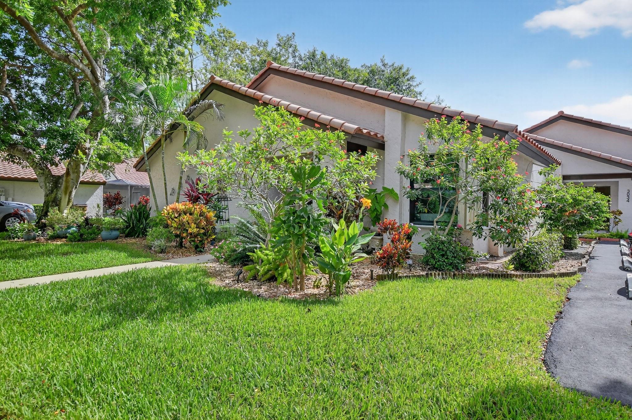 This beautifully updated 2-bedroom, 2-bathroom villa is ready for you to call home. Natural light pours in through new impact windows and sliders, providing peace of mind and energy efficiency. The kitchen is a chef's delight with newer stainless steel appliances, including a refrigerator, range, and microwave, perfect for preparing meals and entertaining guests.
The home also boasts a newer washer and dryer, new toilets and faucets, and modern LED lighting throughout, ensuring a move-in ready experience. Don't miss this opportunity to own a stylish and hassle-free home! Schedule your showing today.