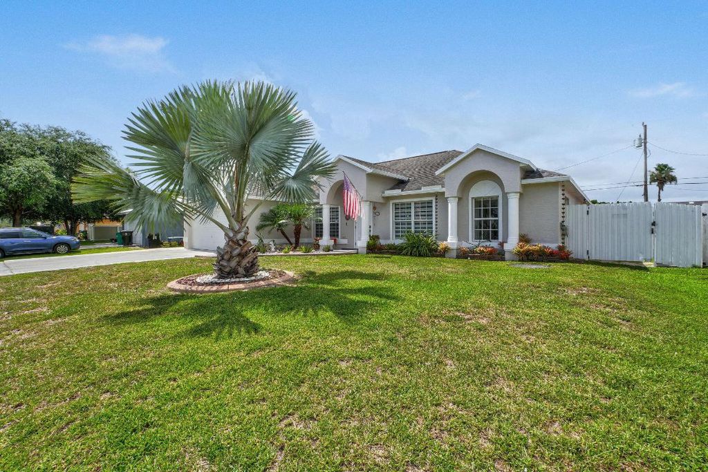 Photo of 850 SW Tulip Boulevard, Port Saint Lucie, FL 34953 (MLS # R11100727)
