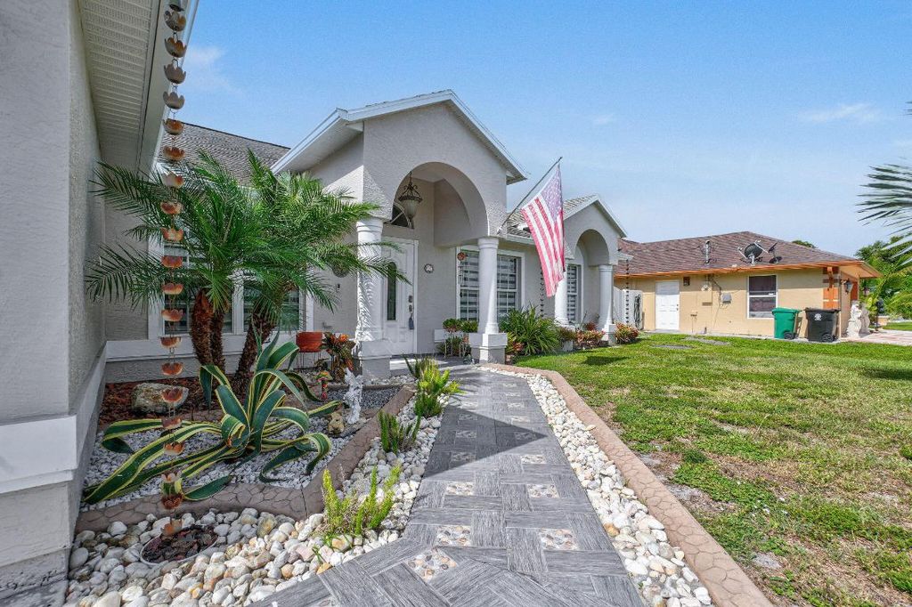 Photo of 850 SW Tulip Boulevard, Port Saint Lucie, FL 34953 (MLS # R11100727)