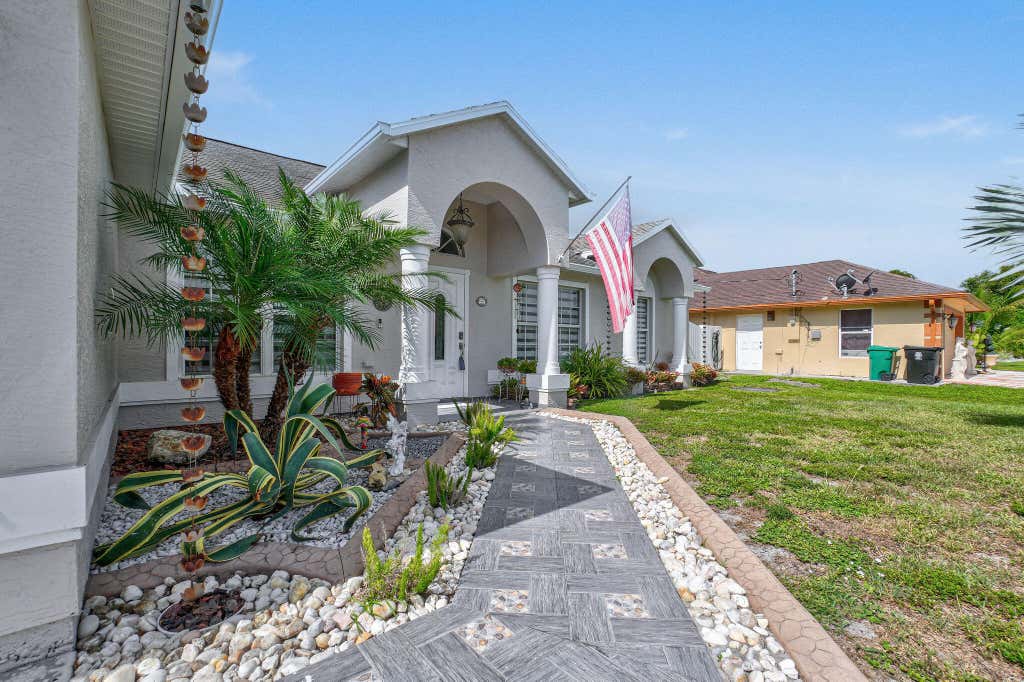 Photo of 850 SW Tulip Boulevard, Port Saint Lucie, FL 34953 (MLS # R11100727)