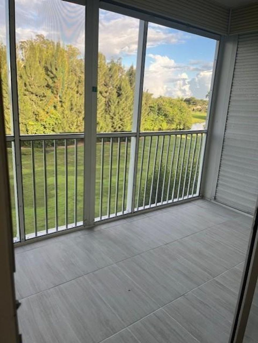 Upscale, updated one bedroom/1.5 bath 4th floor apartment with a golf course view off the screened patio.  Completely updated with an open kitchen that has 42" wood cabinetry, granite countertops, stainless steel appliances.  Freshly painted with all new laminate flooring throughout.  Spacious bedroom with lots of closet space.  Updated full bath with step-in shower, along with an updated 1/2 bath for the use of guests.   Laundry facilities on site.  Complex is in the process of being refurbished.