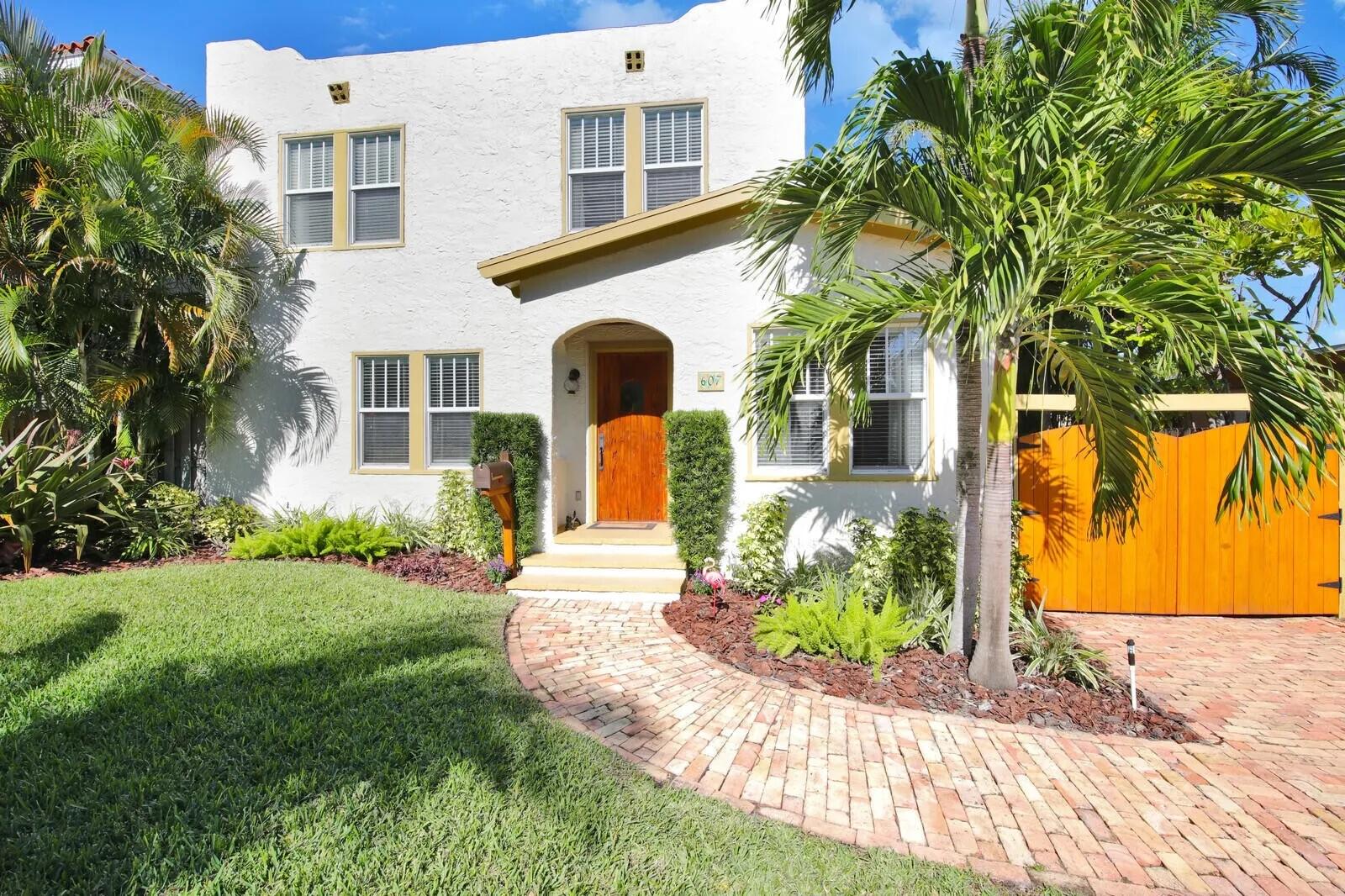 Stunning and fabulous 3BR/2BTH residence in fabulous Flamingo Park. Wonderfully spacious rooms with sunny Florida room, fireplace in living room, breakfast nook, French doors, open staircase to the bedrooms on the second floor. Gas cooktop, pantry, custom cabinets grace the kitchen and the entire home is brightened by the sparkling wood floors. With a well designed layout of brick pavers on the driveway leading to the front door and the rear two car garage is enhanced by the lush landscaping. Great location and close proximity to Palm Beach Island, Grandview Public Market, Norton Dining & Design District, Antique Row, The Square (CityPlace), and Palm Beach International Airport.