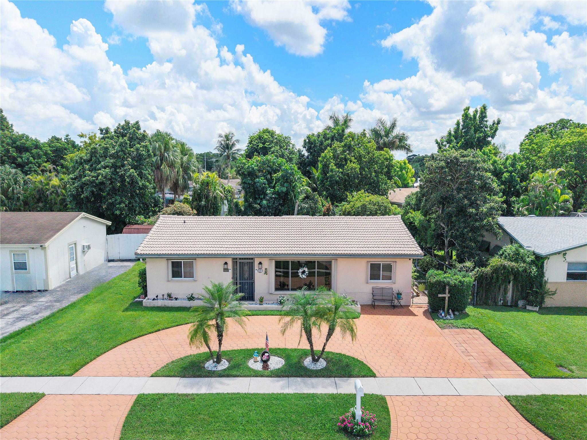 WELCOME HOME to this SPACIOUS REMODELED 3-Bed, 2-Bath HOME, with a HUGE FAMILY ROOM and FENCED BACKYARD. PLUS there is ROOM FOR A POOL! This is an INCREDIBLE PROPERTY with NEUTRAL TILE throughout the living areas, and NEW WOOD-LIKE TILE FLOORING in ALL of the BEDROOMS. The MODERN KITCHEN has been FULLY UPDATED with GRANITE COUNTERS, S/S APPLIANCES, and a LARGE PANTRY. The MAIN BEDROOM OFFERS a WALK-IN CLOSET, and EN-SUITE UPDATED BATHROOM. The FLORIDA ROOM can easily CONVERT to a 4th BEDROOM or PLAYROOM too! GREAT SPACE with a CASUAL DINING area or an OFFICE. INCREDIBLE STORAGE ROOM includes the WASHER & DRYER, and 2 EXTERIOR STORAGE ROOMS too! FEATURES include: CROWN MOLDING, PLANTATION SHUTTERS, HURRICANE SHUTTERS, a BIG GAZEBO in the backyard and AMAZING TROPICAL LANDSCAPING. * NO HOA *