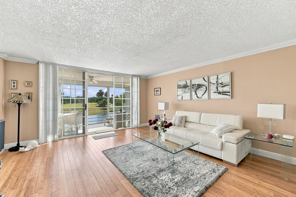 Photo of 3980 Oaks Clubhouse Drive #212, Pompano Beach, FL 33069 (MLS # B26086796)