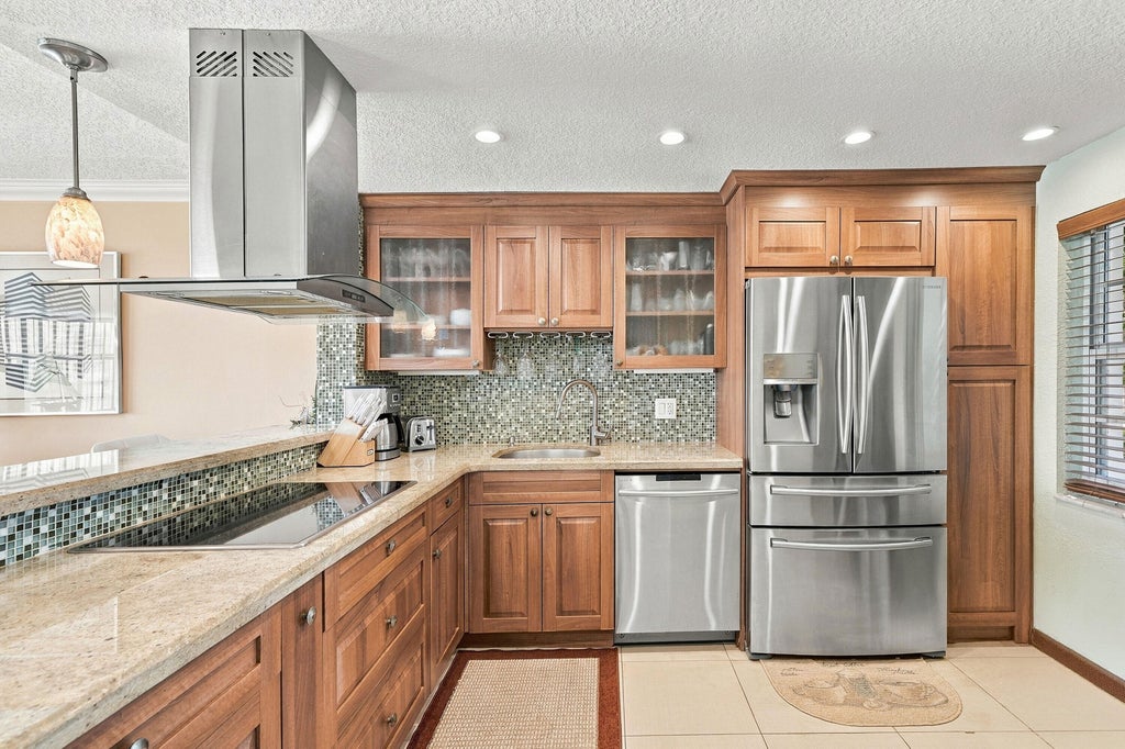 Photo of 3980 Oaks Clubhouse Drive #212, Pompano Beach, FL 33069 (MLS # B26086796)