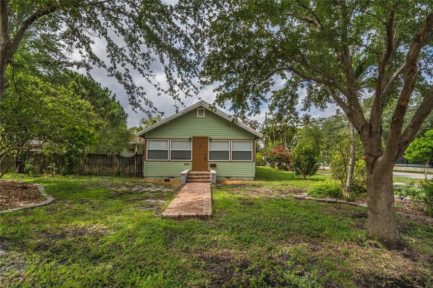 STUNNING Classic Old Pompano home! Restored & thoughtfully upgraded w original Dade Pine floors. Spectacular Chef's Kitchen upgraded w stainless appliances & granite counters. Hurricane Impact windows 2014 w gable shutters. Hurricane code concrete garage. Tankless gas water-heater, Brick Fireplace (gas) House alarm/Video security; Hard wired smoke detector. A/C 2012, Roof 2005. Park your boat or RV; ample driveway. Quarter-acre lot. Rainwater collection system. Corner lot amid serene Native landscaping.