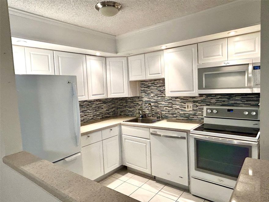 Welcome to this spacious and well-maintained 2 bedroom, 2 bathroom condo located in a peaceful 55+ community in Tamarac. This charming apartment offers a comfortable layout, a large screened-in balcony, and in-unit washer and dryer. This vibrant active community offers fantastic amenities, including a clubhouse, pool, fitness center, tennis courts and social activities. Conveniently located near shopping, dining, this is the perfect place to enjoy South Florida living at its best.