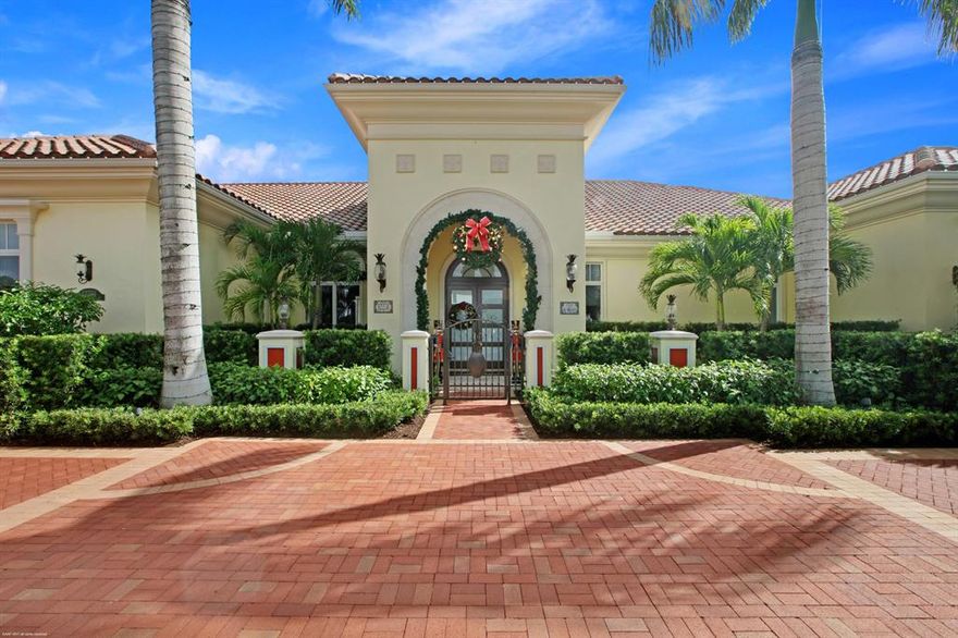 Great opportunity to own an immaculate one-acre golf course home within the Custom Estates section of exclusive Old Palm Golf Club! This sprawling one story home boasts volume ceilings, beautiful custom temperature controlled wine room, lavish theater room, spacious office, exquisite master suite with His & Her bathrooms, morning bar & large walk in closets with storage to the ceiling.  The family room is perfect for entertaining, featuring a sunken wet bar, breakfast nook and is open to the gourmet kitchen with double islands, 2 1/2 ovens, 2 microwaves, 2 sinks and walk in pantry.  Between the kitchen and dining room is the large butler serving pantry w/ wine refrigerator, sink and additional storage.
The screened-in covered lanai is a great place to host a bar-be-cue or gather with family & friends, featuring a built in bbq & built in drawers/doors for storage.  Relax in the custom heated pool or spa while soaking in the tropical landscape views & golf course beyond.  There's a very large bonus room above the garage that would make a perfect Nanny or In-law suite.
Other features of interest: whole house generator, safe room, hurricane protected lanai, hurricane screening for additional protection on the master bedroom, beautifully finished garage that is temperature controlled, synthetic turf on the entire backyard & sides of the home.