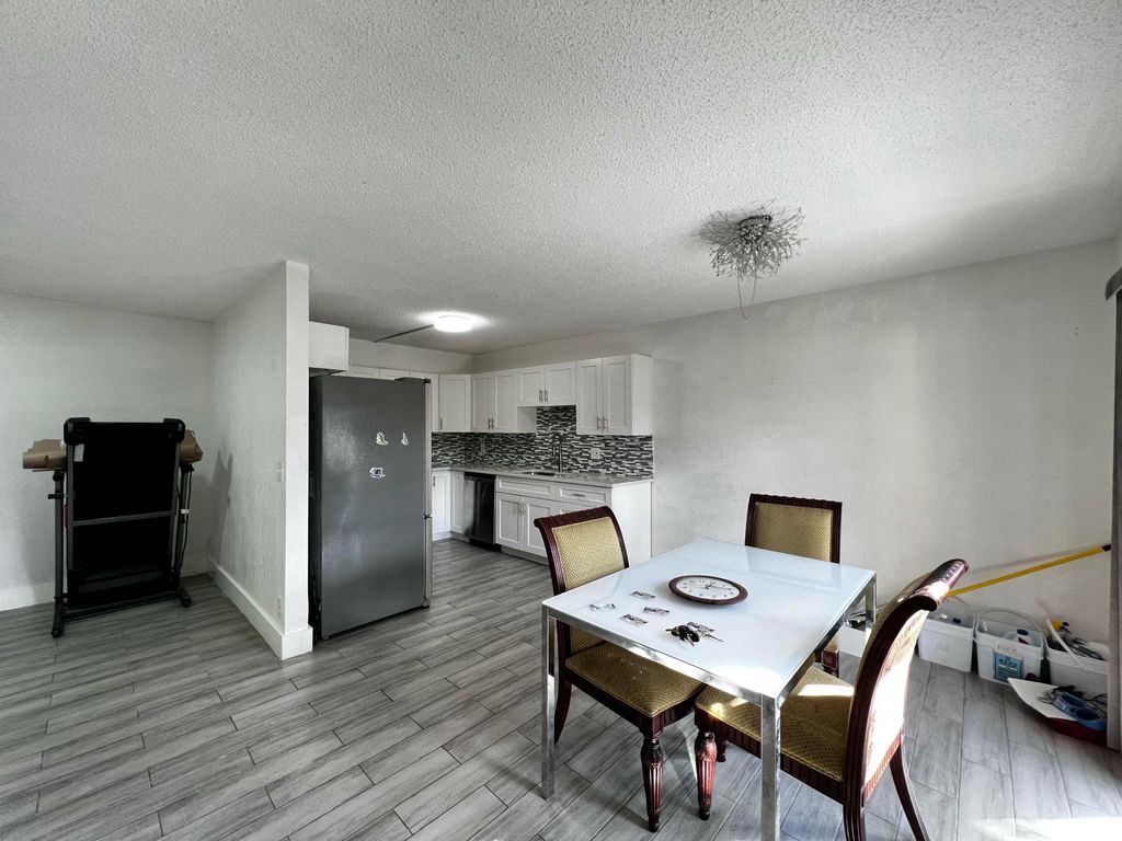 Photo of 295 Woodland Road, Palm Springs, FL 33461 (MLS # B26043314)