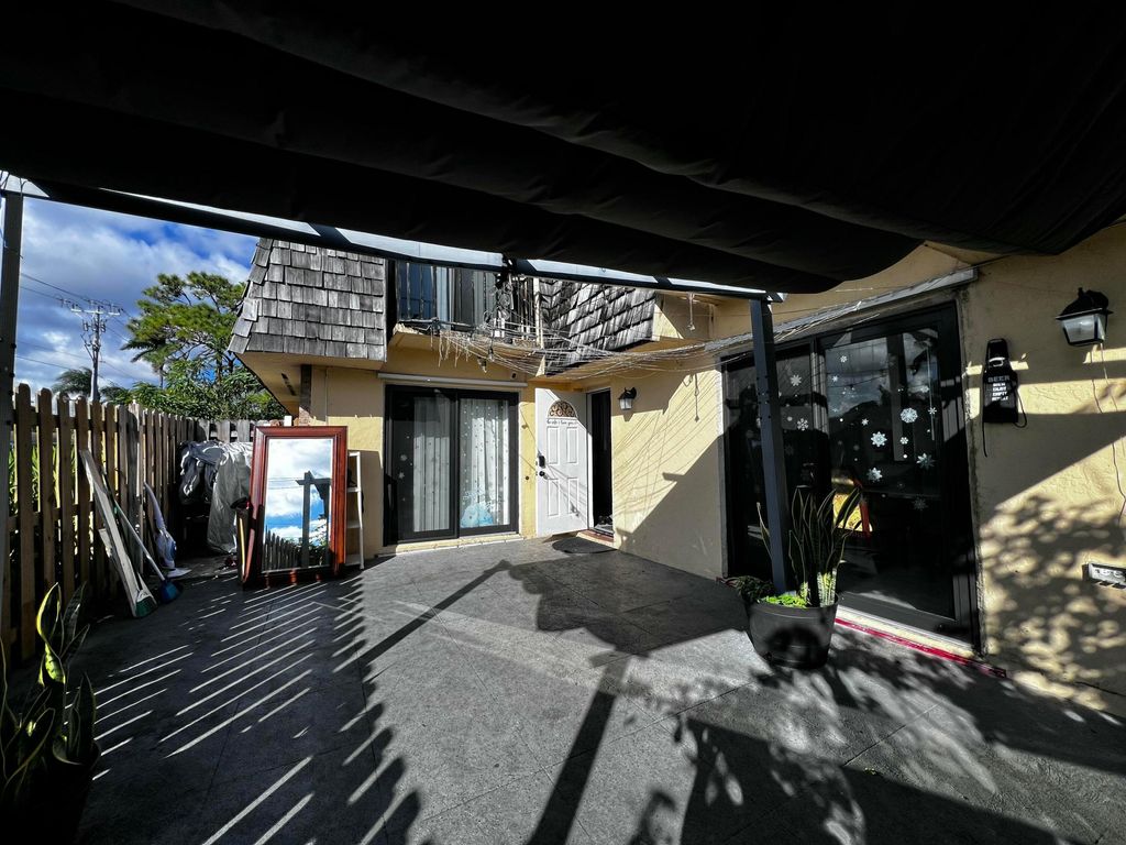 Photo of 295 Woodland Road, Palm Springs, FL 33461 (MLS # B26043314)