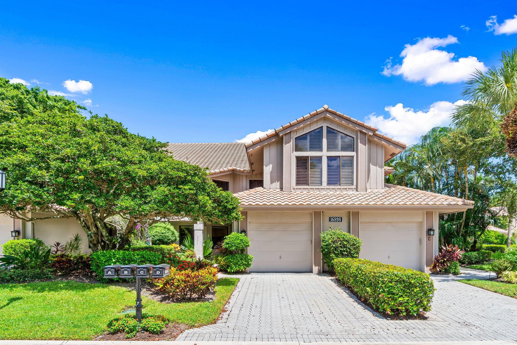 Step into this beautifully updated first-floor condo in Cypress Isle, boasting breathtaking panoramic lake views, private outdoor space, and a spacious, thoughtfully designed layout. This light-filled residence offers 2 bedrooms plus a versatile den, 2.5 bathrooms, and a 1-car garage, perfect for comfortable, stylish living. Enjoy hurricane-impact windows throughout and a fully enclosed patio with impact-resistant bi-fold doors, seamlessly extending the living space for a true indoor-outdoor experience. Whether you're relaxing or entertaining, the stunning lake views provide the perfect backdrop. A rare opportunity to enjoy secure, sophisticated, and effortless living in a prime location. Don't miss out!