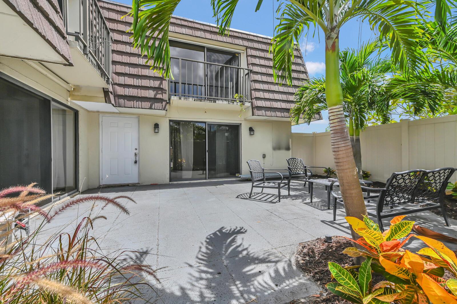NEW ROOF & FENCE!!! NO SPECIAL ASSESSMENT!!! Seller already paid roof & fence assessment in full. Prepare to discover an exceptional urban retreat in this large two-story townhouse, perfectly positioned just minutes from the vibrant heart of Downtown West Palm Beach! This meticulously maintained, move-in ready, and boasts a unique and highly desirable feature: two private master suites. Each expansive master bedroom offers its own ensuite bathroom and a charming private balcony, providing serene personal outdoor spaces. Additional generous bedrooms and a convenient guest bath ensure comfort and flexibility for residents and visitors alike.
