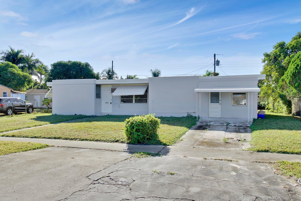 Photo of 3934 Tuskegee Drive, Lake Worth, FL 33462 (MLS # R11056196)