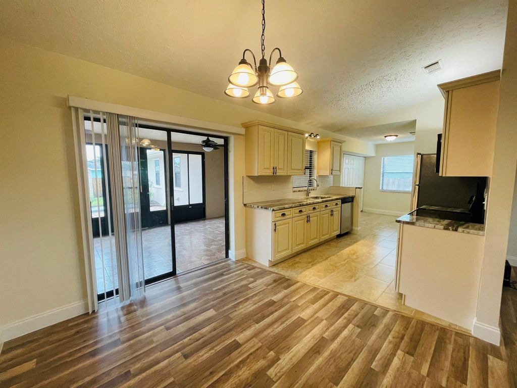 Photo of 667 SE Crescent Avenue #1, Port Saint Lucie, FL 34983 (MLS # R11084205)