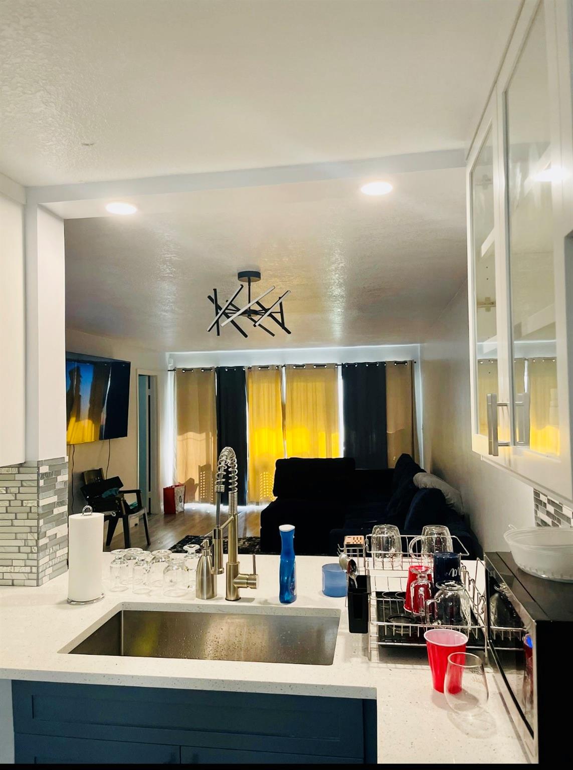MAJOR PRICE DROP!!! Beautifully upgraded and remodeled 2 bed 2 bath, condo in the desirable community of Woodmont in Tamarac. This condo features 2 master bedrooms with an open concept living and dining. Custom designed kitchen with a coffee bar, glass cabinets, built in pantry, beverage fridge, spice cabinet and more. New vinyl flooring, walk in closets and screened in patio with backyard access. Stackable washer/dryer included in the unit. This is a great unit, in a family friendly neighborhood. Easy access to excellent schools, highways, entertainment, malls and more. NO RENTAL RESTRICTIONS!