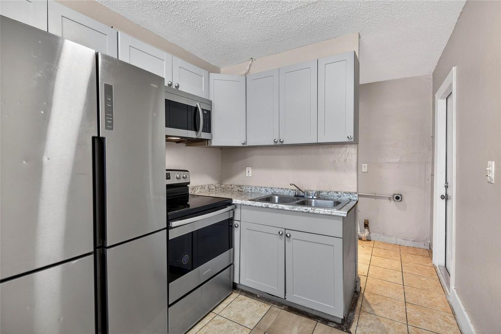 Photo of 1230 NW 29th Way, Fort Lauderdale, FL 33311 (MLS # F10554327)