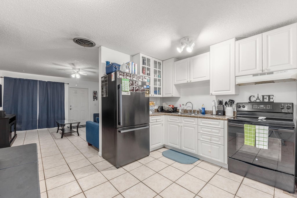 Photo of 3059 SE Amherst Street #3059-3069, Stuart, FL 34997 (MLS # R10982915)