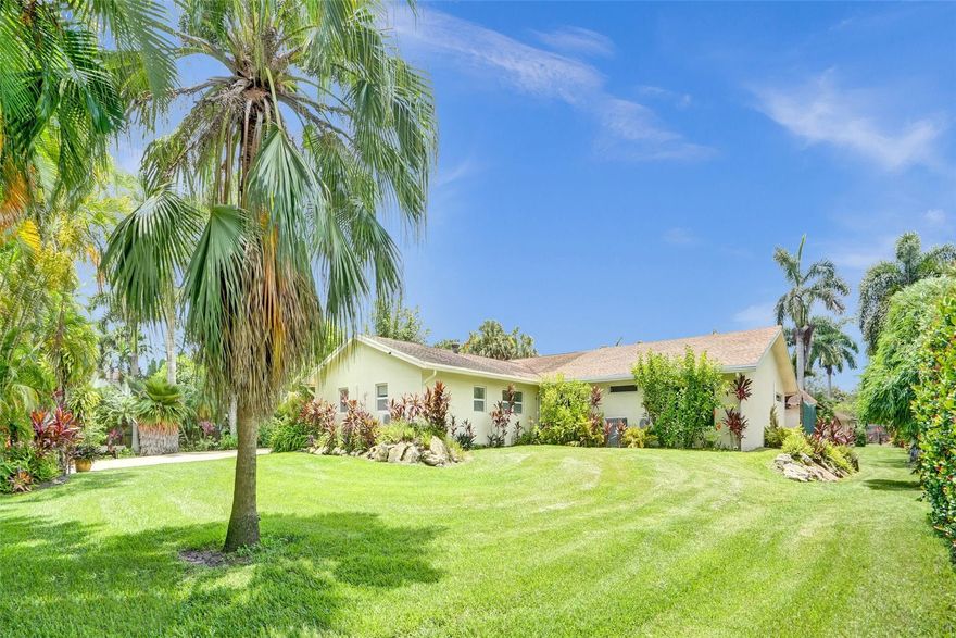 This lushly landscaped 1.13 acre estate is perfect for professional and personal pursuits. This single-story home has the ideal layout for multigenerational living with 2 expansive suites in separate wings of the home. Enjoy gorgeous tropical sunsets from the heated pool or your master suite.  This home offers countless options with 2 outbuildings, creating a detached guest bedroom, home office or playroom. There is a 2nd secured driveway and additional 2 car garage workshop, ideal for business owners, contractors, car enthusiasts, or anyone seeking to work from home, however wants to keep the two separate. The primary house features 5 large bedrooms, 5 full baths. The entirety of the estate is securely fenced and offers ample parking for trucks, boats, RVs, equipment, etc. Minutes to I-75