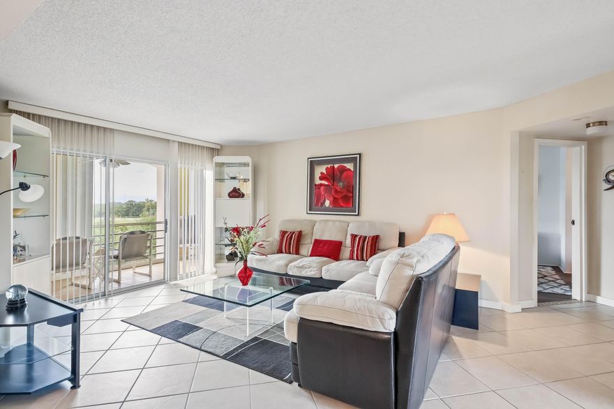 WELCOME TO VIEWS OF THE GOLF COURSE & LAGOON FROM A SCREENED 23' LONG BALCONY THAT OPENS INTO THE EAT-IN KITCHEN, LIVING ROOM & MASTER BEDROOM. WITH ITS VERY POPULAR FLOORPLAN, THIS CONDO IS ALSO CONVENIENT TO THE ELEVATOR & ALSO TO THE BUILDING POOL. AN ADDITIONAL POOL IS AT THE CLUBHOUSE WITH ITS TENNIS, PICKLEBALL, PAY-AS-YOU-PLAY GOLF, GYM, CLASSES, MEL'S BISTRO & ENTERTAINMENT. THIS CONDO IS AVAILABLE FURNISHED OR UNFURNISHED. PRICED TO SELL QUICKLY!  NOTE A SENIOR COMMUNITY, NO PETS.