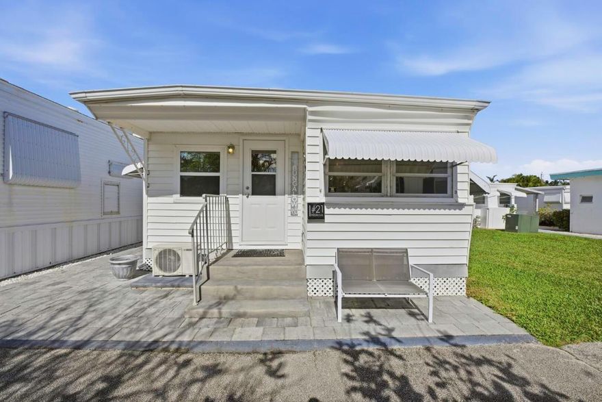 This is a rare opportunity to own in Briny Breezes—an exclusive oceanfront enclave where every day feels like a resort vacation. Fully furnished, move-in ready, and available immediately, this beautifully renovated home offers comfort, efficiency, and effortless beachside living. The updates are extensive and thoughtfully completed, with nearly every feature replaced or upgraded. Major improvements include all-new plumbing, a new water heater with convenient access, and a highly efficient mini-split A/C system providing zoned cooling. A washer and dryer—an exceptional rarity in the community—add everyday convenience. Electrical and lighting upgrades feature new outlets with GFI protection, along with new ceiling lights and fans throughout. The kitchen has been refreshed with new cabinetry and countertops, a new stove and oven, and an oversized microwave. The bathroom has been completely updated with new fixtures, including a toilet, shower, and sinks.

Interior enhancements include new wall paneling, durable water-resistant flooring, and clean, modern finishes designed for easy, low-maintenance coastal living. Outside, the home shines with a new front door and window, all windows tinted for privacy, heat reduction, and UV protection, and new pavers that enhance curb appeal and outdoor enjoyment.

The only item not newly replaced is the refrigeratoreverything else has been thoughtfully upgraded.

This is true turnkey coastal livingjust bring your suitcase and toothbrush. Whether you're seeking a seasonal getaway, a full-time beach home, or a lock-and-leave Florida retreat, 21 Hibiscus Drive I offers exceptional value within one of South Florida's most unique and desirable oceanfront communities.

If you're looking for easy living, minimal maintenance, and a true vacation lifestyle, this home checks every box.