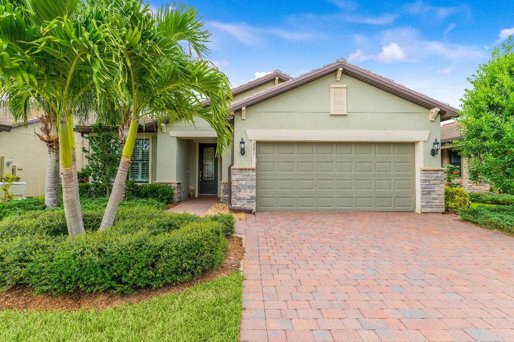 Photo of 221 SE Longview Drive, Port Saint Lucie, FL 34984 (MLS # R10939046)