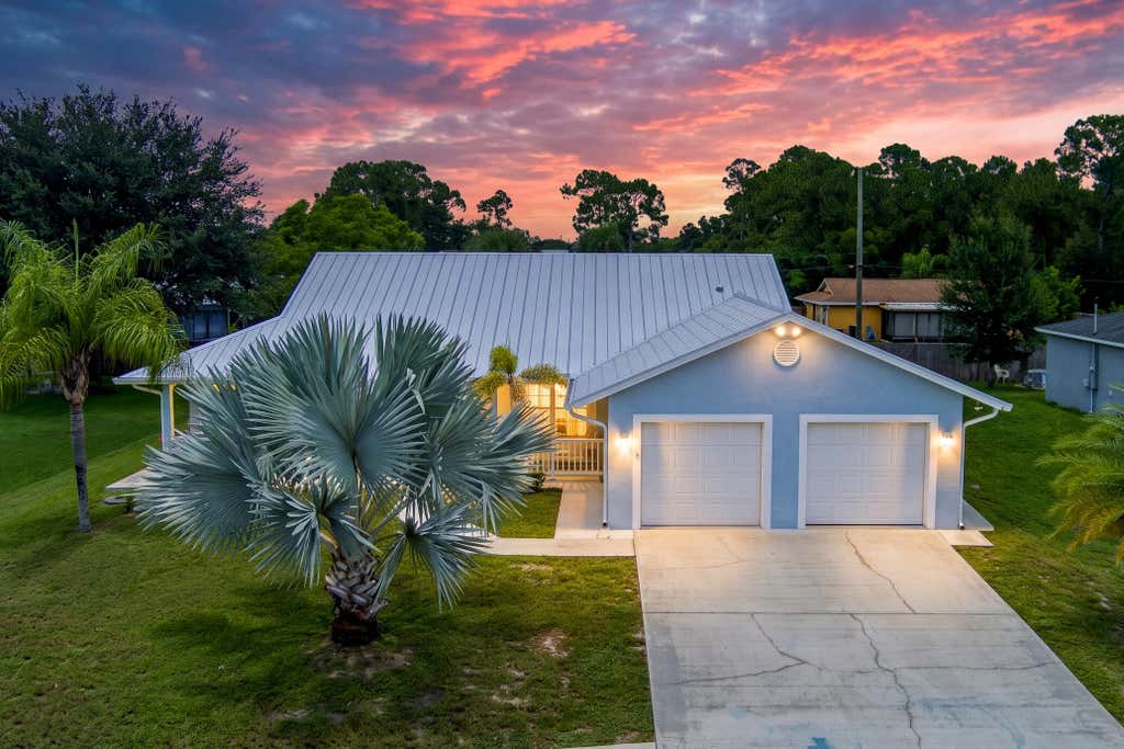 Photo of 937 SW SOUTH GLOBE Avenue, Port Saint Lucie, FL 34953 (MLS # B26053393)