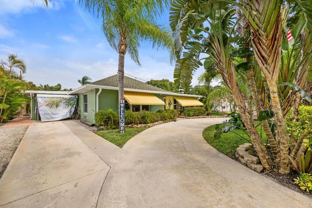 Photo of 139 Evergreen Drive, Lake Park, FL 33403 (MLS # R10975111)