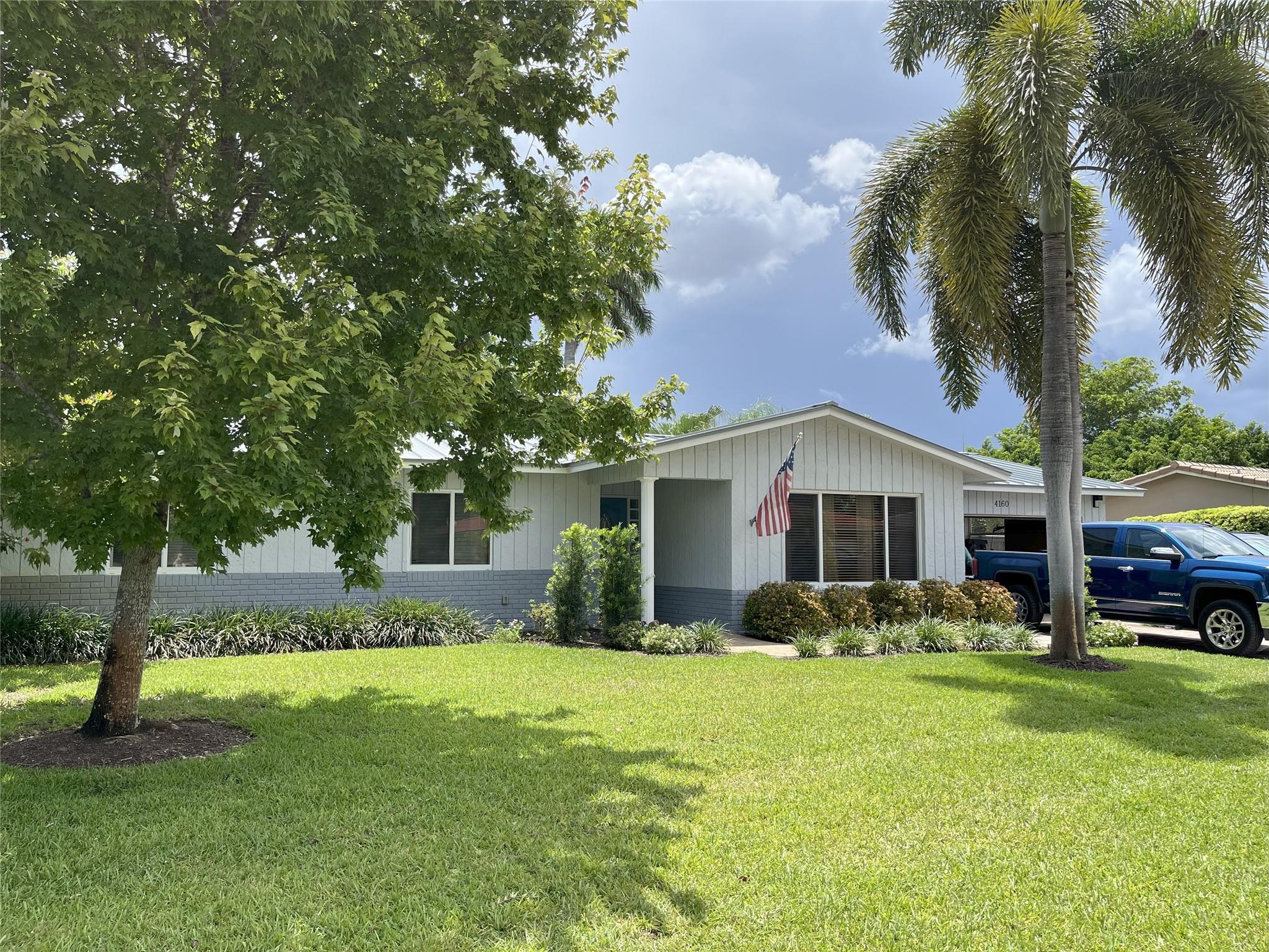 OUTSTANDING IS THE WORD FOR THIS ONE!! METICULOUSLY MAINTAINED AND BEAUTIFULLY UPGRADED HOME SITS ON A GORGEOUS PARK LIKE OVERSIZED LOT WITH A VERY PRIVATE FENCED BACK YARD. NO PROBLEMS GETTING INSURANCE AS IT HAS A ONE YEAR OLD METAL ROOF & IMPACT WINDOWS. OTHER FEATURES INCLUDE A PAVER DRIVEWAY, A WONDERFUL UPDATED KITCHEN WITH QUARTZ COUNTERS & NEWER STAINLESS APPLIANCES & FARM SINK, A/C 2019, UPDATED PRIMARY BATH, ELECTRIC PANEL 2023, REAL WOOD & PORCELAIN TILE FLOORS, CUSTOM CROWN MOLDING, A/C IN THE GARAGE FOR THOSE THAT ARE HANDY, AND A BEAUTIFUL FRONT DOOR. SITUATED ON A LOVELY CULDESAC STREET CLOSE TO SCHOOLS AND SHOPPING AND EASY ACCESS TO THE SAWGRASS EXPRESSWAY. NO HOA TOO!