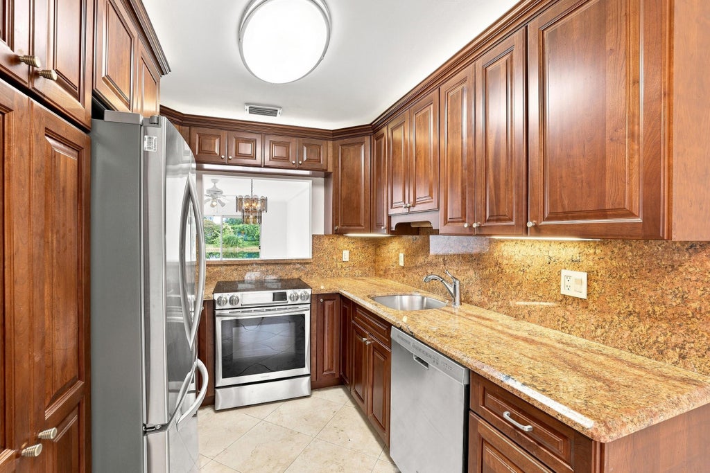 Photo of 8829 BELLA VISTA Drive #282, Boca Raton, FL 33433 (MLS # B26061860)