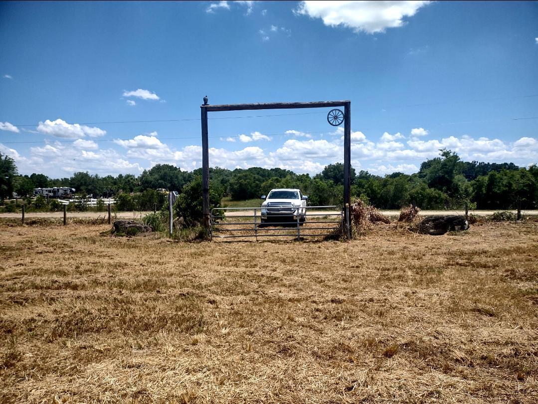 Looking for your homestead property? This one is ready for you. Seller already cleared the 1.25 acre lot, installed 2'' well, electricity, has a pond, heavy duty culvert, and is partially fenced. Come live your life or enjoy as a vacation home connected to thousands of acres. Great for camping with RV, 4wheelers, and horse back riding. Ag zoned property is set up with a ranch style entry gate made of rugged poles designed to hang a large family sign.