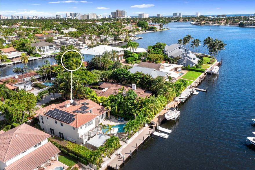 Lifestyle & location define this Coastal inspired residence. Ideal for boating with 75' of straight line dockage, 5 homes from the point & mins. to the Intracoastal & Atlantic Ocean. The spacious & luminous open floor plan has multiple living areas & is conducive to today's contemporary lifestyle w/special touches that infuse modern upscale comforts. The gourmet kitchen boasts a large center island, perfect for entertaining or small gatherings. The primary suite features a custom walk-in closet, spa inspired bathroom & pvt. balcony overlooking the waterway. The resort style backyard lives like a vacation w/an oversized pool, summer kitchen & al fresco dining within the louvered gazebo. A 10KW solar system provides great energy savings. All Measurements are approximate & should be verified.