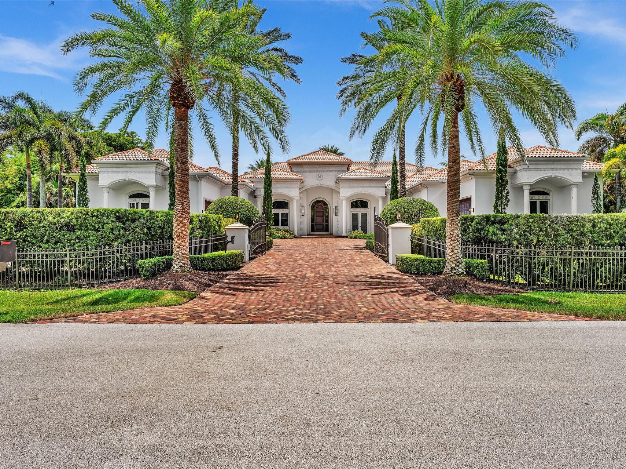 If you are about the details, then you will fall in love with this 7BR, 8.5BA estate on 1.22 acres in prestigious Plantation Acres, surrounded by Areca Palms for privacy. Boasting 6,842 sq ft with 14-ft ceilings, this custom home offers a chef’s dream kitchen with Sub-Zero refrigerator/freezer, 4 pull out Sub Zero refrigerated drawers, Wolf stove with 6 burners and 2 ovens, Control 4 smart system, projector-equipped media room, and spacious laundry. Each bedroom features a walk-in closet and en-suite bath. The lavish primary suite includes custom closets, including 2 "hers" closets. The spa-style bath has 2 private toilet rooms with Toto Washlet toilets. Resort-style living continues outdoors with a heated pool, koi pond, Alfresco grill, guest house, gated entry, and whole-home generator.