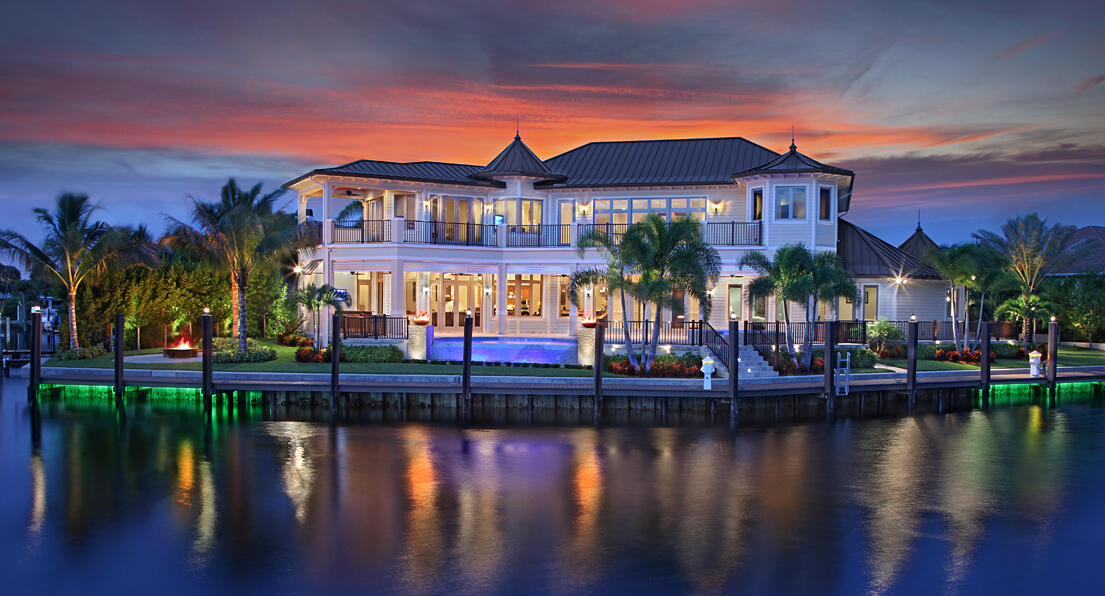 One of a Kind custom estate home on a point lot with turning basin and 210' of protected deep water dockage. If you have a Sportfish/Motor Yacht up to 90' and a large Center Console then this is the house for you! This home features marble and wood floors, coffered and volume ceilings, all en-suite bedrooms, a guest quarters with kitchenette, panoramic views from most rooms, Chef's kitchen with top of the line appliances and large Butler's pantry, an elevator, a tackle/safe room, an office with custom built-ins and wood floors that has a full bathroom and walk-in closet to be a 6th bedroom. Other amenities include a custom wet bar with Onyx tops, a 60 KW Kohler generator, Crestron system, exterior camera system, two tank-less gas water heaters with an electric backup... (See Supplement)