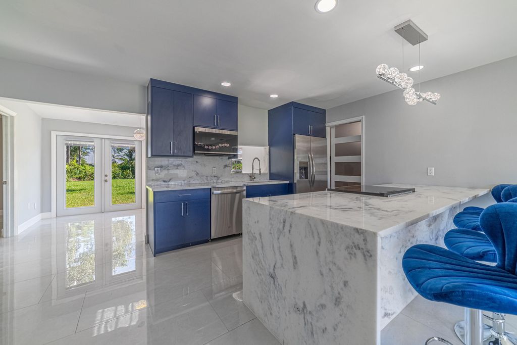 Photo of 1809 SW Capehart Avenue, Port Saint Lucie, FL 34953 (MLS # B26015902)