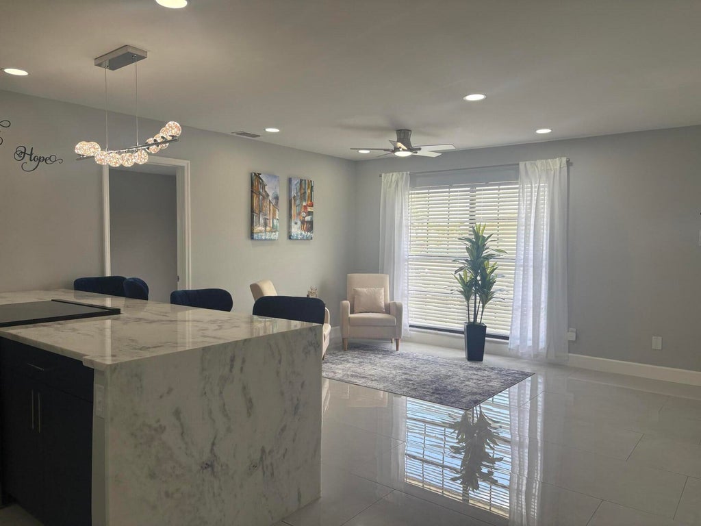Photo of 1809 SW Capehart Avenue, Port Saint Lucie, FL 34953 (MLS # B26015902)