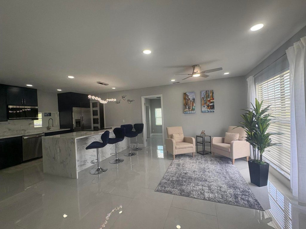 Photo of 1809 SW Capehart Avenue, Port Saint Lucie, FL 34953 (MLS # B26015902)