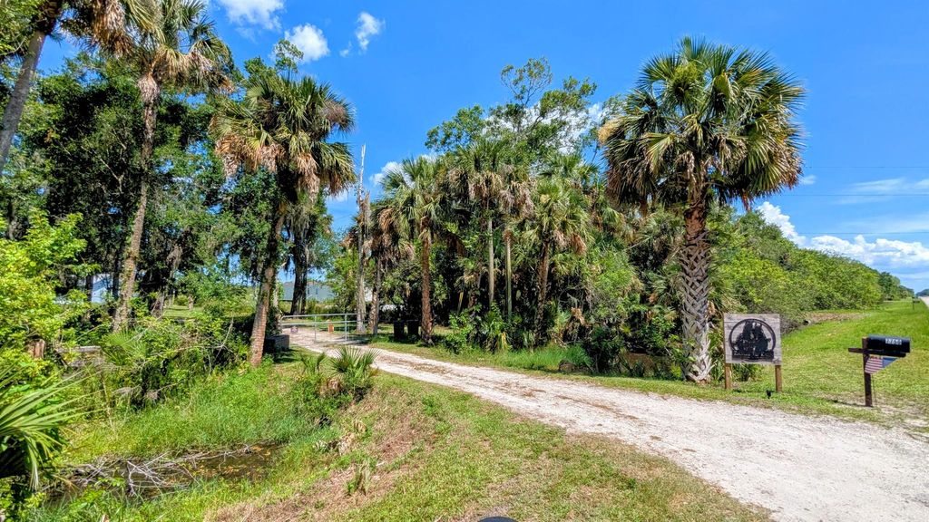Photo of 7750 Germany Canal Road, Port Saint Lucie, FL 34987 (MLS # R11101426)