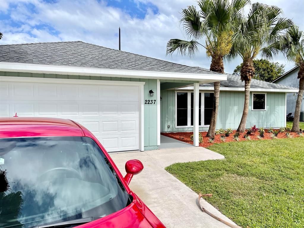 Photo of 2237 SE Trillo Street, Port Saint Lucie, FL 34952 (MLS # R10704152)