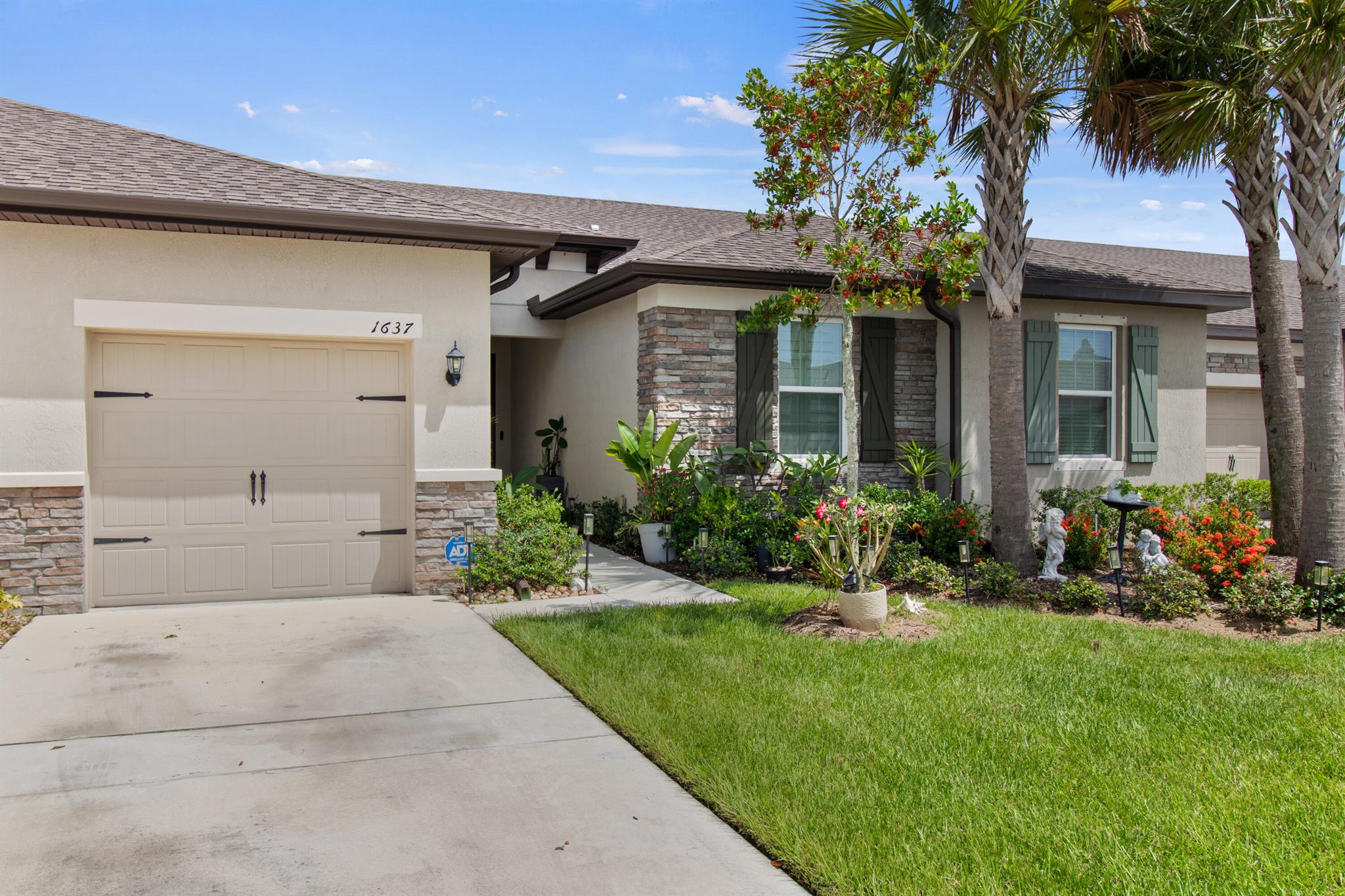 This beautifully designed 3-bedroom, 2-bath waterfront home welcomes you with a bright, open floor plan. From the moment you walk in, the water view is the first thing you notice. The layout keeps the living, dining, and kitchen areas connected, creating a space that works just as well for quiet mornings as it does for hosting friends. The kitchen is anchored by a massive island -- big enough for meal prep, casual dining, and conversation -- complete with a farmer's sink, wraparound breakfast bar, and built-in outlets. Stainless steel Whirlpool(r) appliances, granite counters, and white cabinets with crown molding make it as practical as it is attractive.