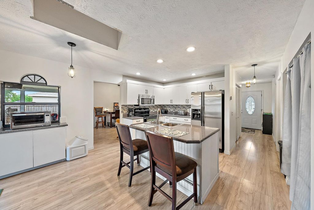 Photo of 622 SW Hogan Street, Port Saint Lucie, FL 34983 (MLS # R11140174)