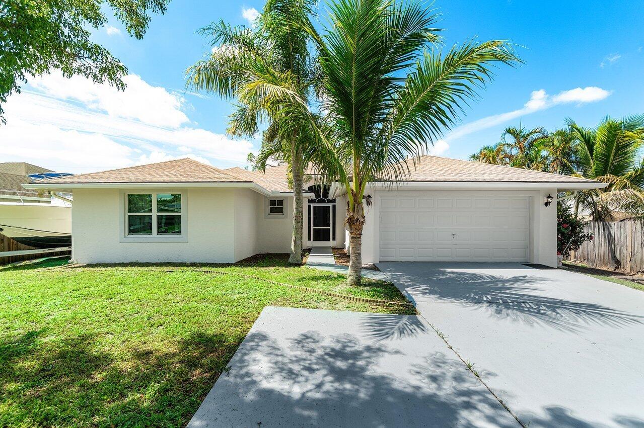 Welcome to this beautifully maintained 3-bedroom, 2-bathroom single-family home in Lake Worth with NO HOA or restrictions--bring your boat, RV, or pets! Enjoy the light and airy feel of vaulted ceilings and a spacious open floor plan. The updated kitchen features modern finishes and plenty of counter space, perfect for cooking and entertaining. Peace of mind comes with a brand-new roof installed in 2024. Conveniently located near shopping, dining, beaches, and major highways, this home offers flexibility, comfort, and value. Don't miss this rare opportunity!
