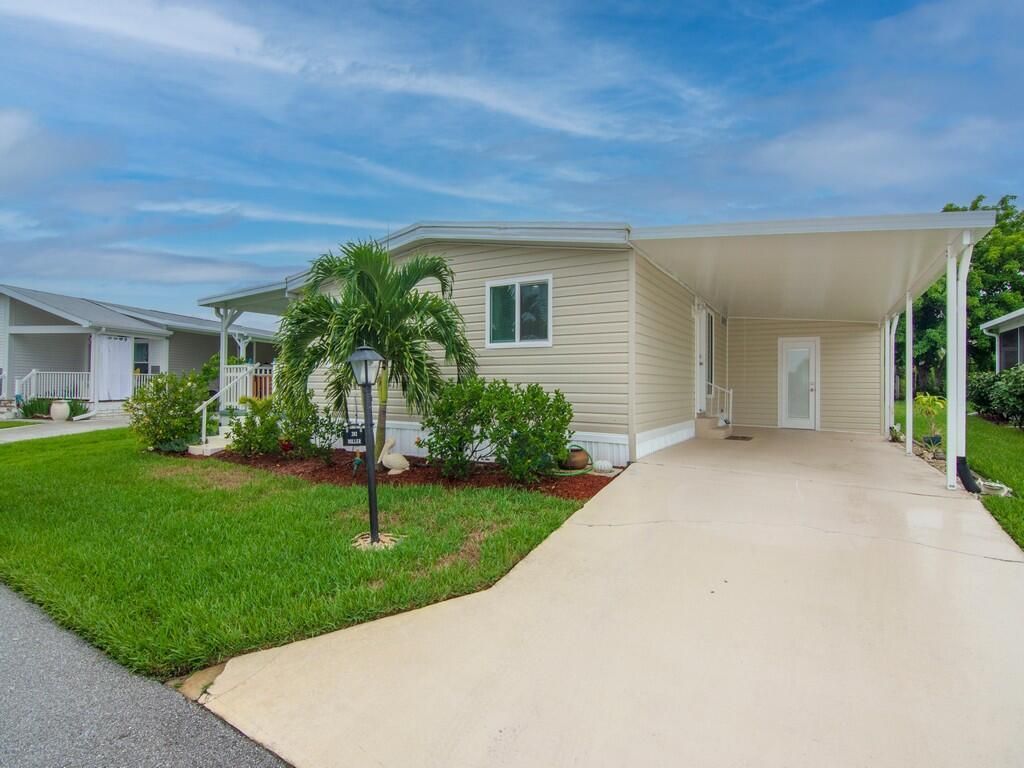 Photo of 202 NE Woods Way, Jensen Beach, FL 34957 (MLS # R10908621)