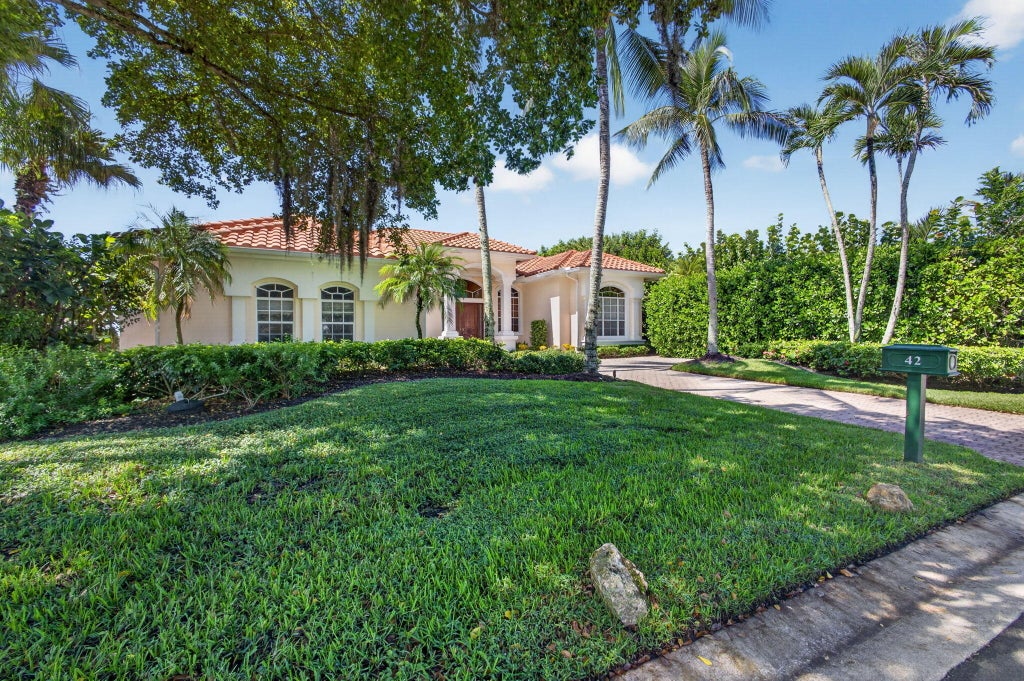Photo of 42 Windward Isle, Palm Beach Gardens, FL 33418 (MLS # B26088357)