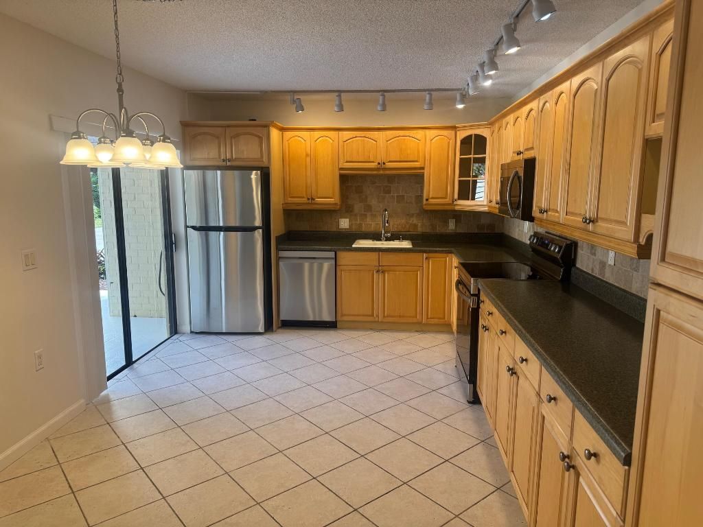 Photo of 1615 16th Terrace, Palm Beach Gardens, FL 33418 (MLS # R11156191)