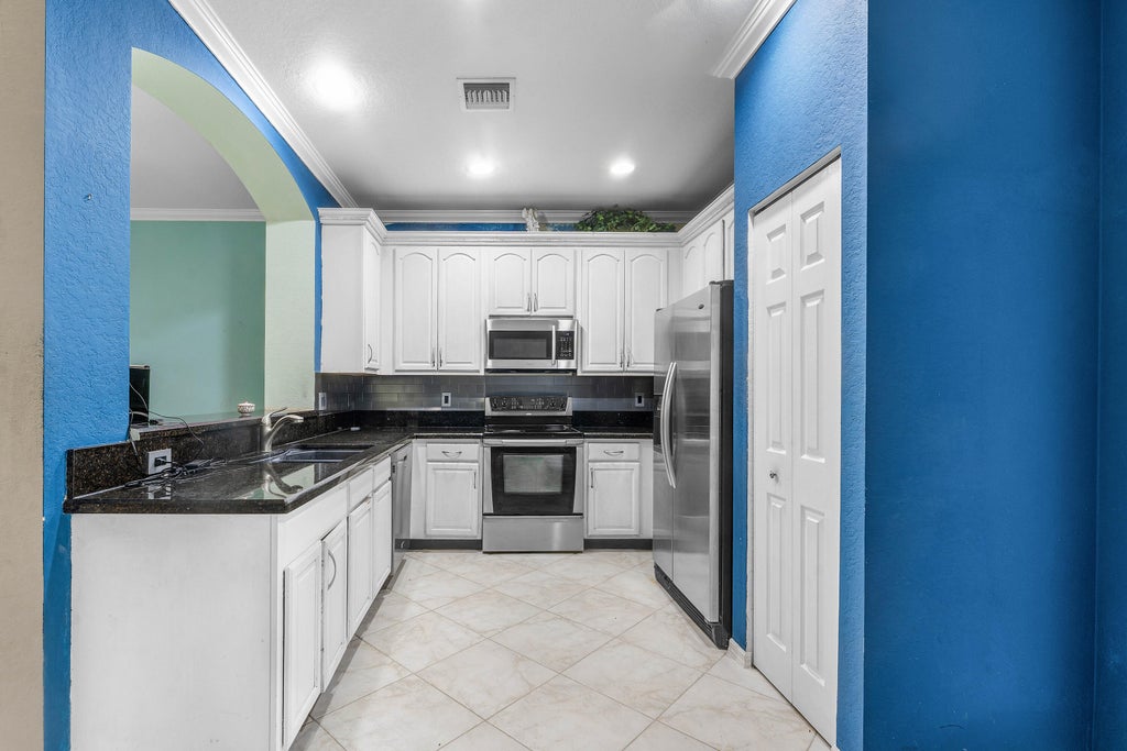 Photo of 341 INDIAN CREEK Parkway #103, Jupiter, FL 33458 (MLS # B26069821)