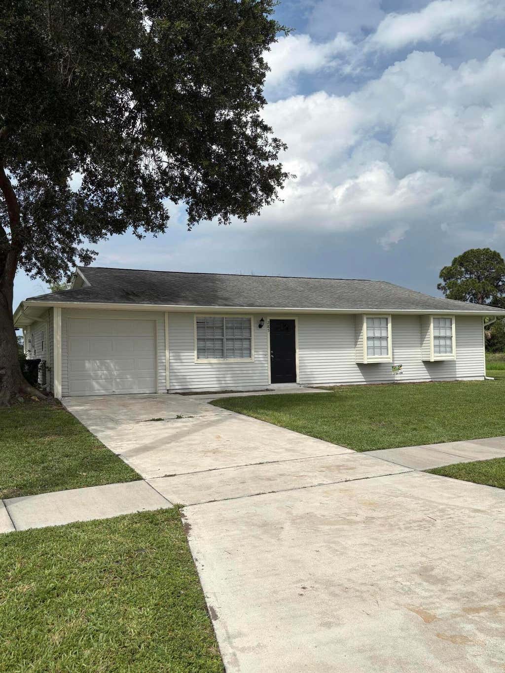 Photo of 285 NE Floresta Drive, Port Saint Lucie, FL 34983 (MLS # B26037057)